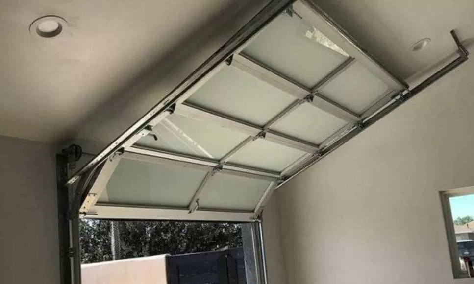 réparation porte sectionnelle Louvres