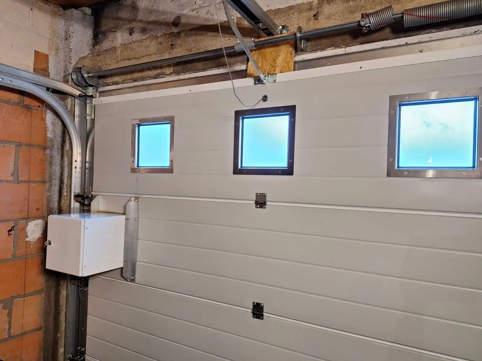 reparation porte sectionnelle Suresnes