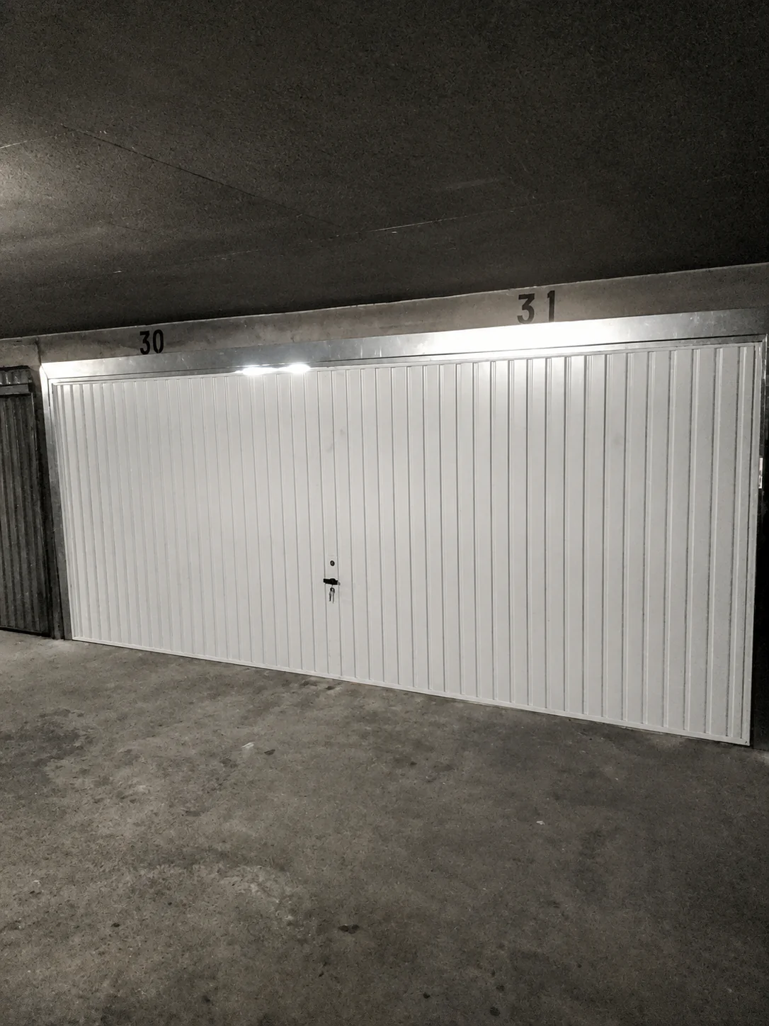 Porte de garage basculante fonctionnelle après remplacement des ressorts de traction à Neuilly-sur-Seine 92200