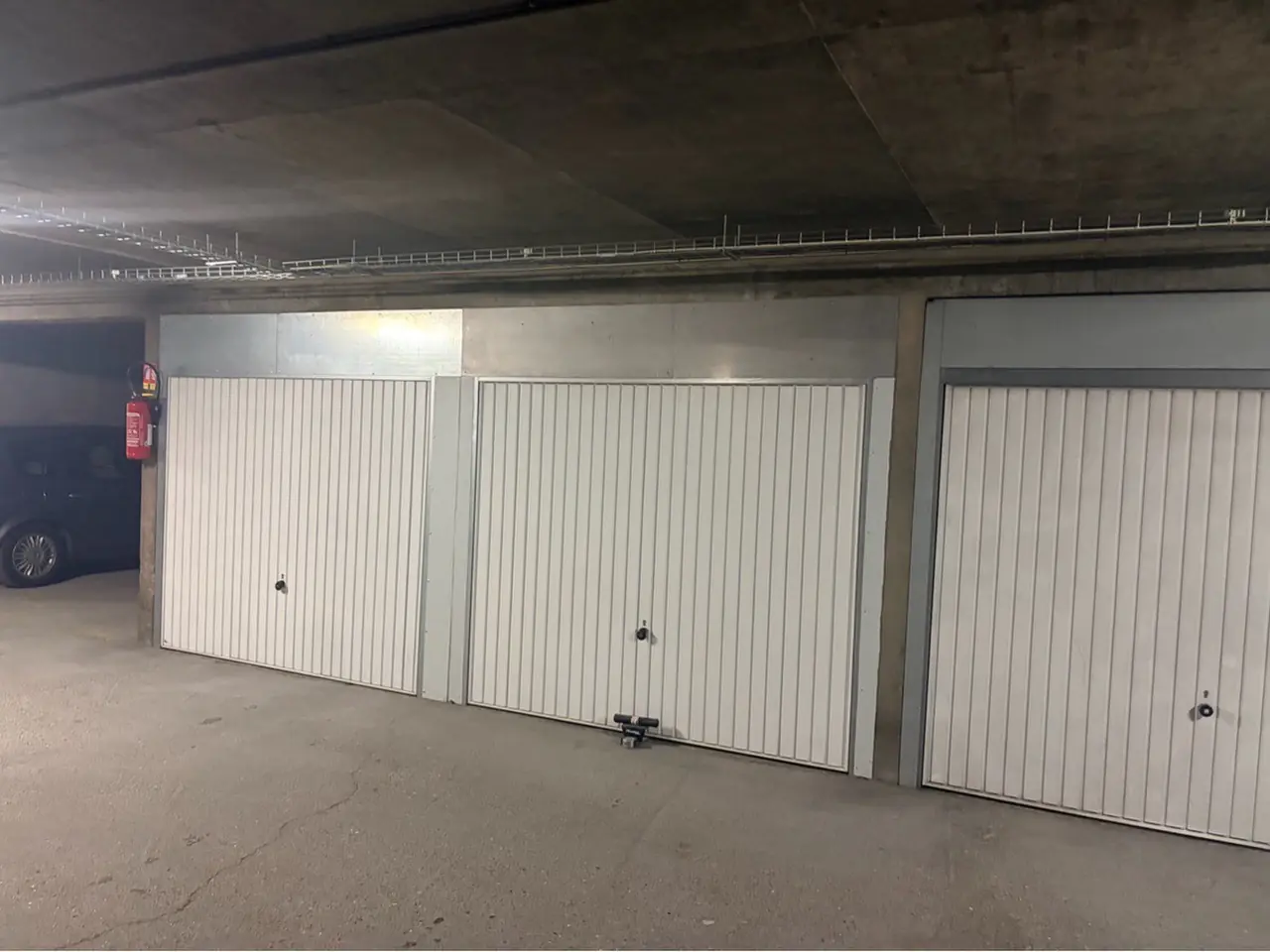 Intervention MGParis : Pose porte de garage basculante Arcueil