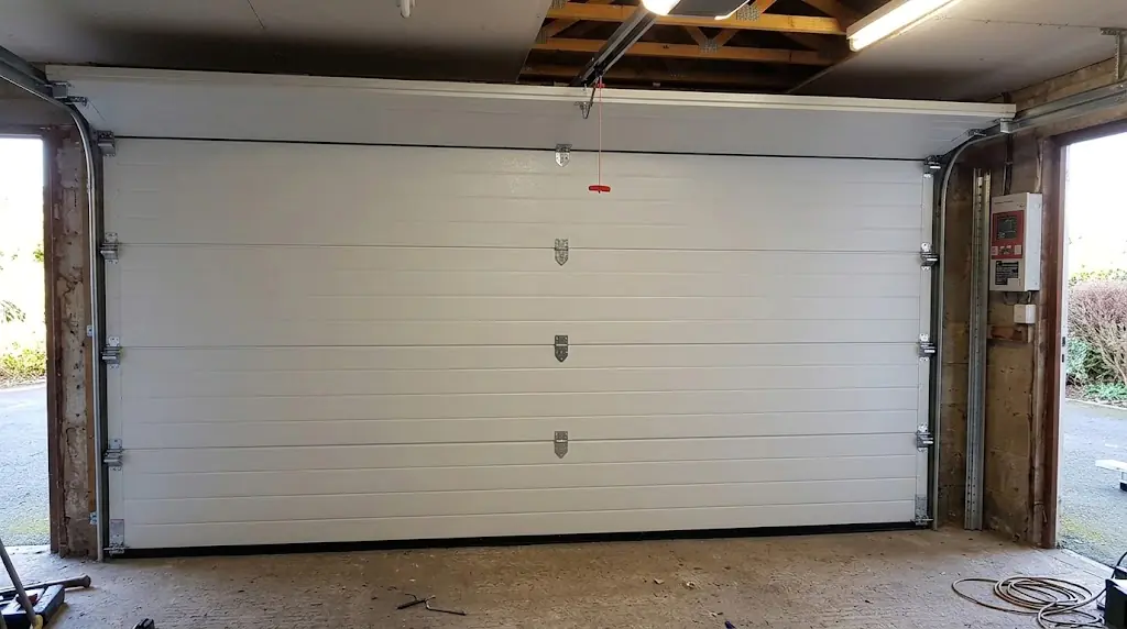 Réparation porte de garage à Montchauvet