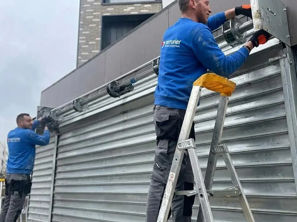 Remplacement axe motorisé de rideau métallique Maisons-Laffitte